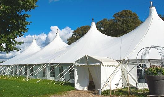 a line of sleek and modern portable restrooms ready for use at an upscale corporate event in Tisbury